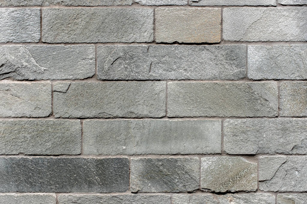 Closed up grey brick wall texture. Architectural material construction. - Foto, Imagen