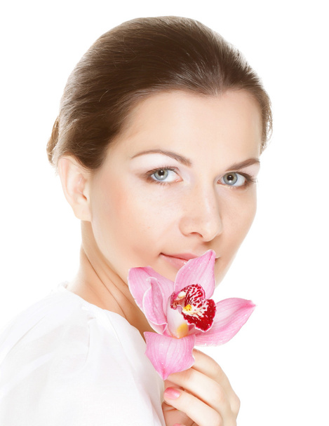 Young beautiful woman holding pink flower - Fotografie, Obrázek