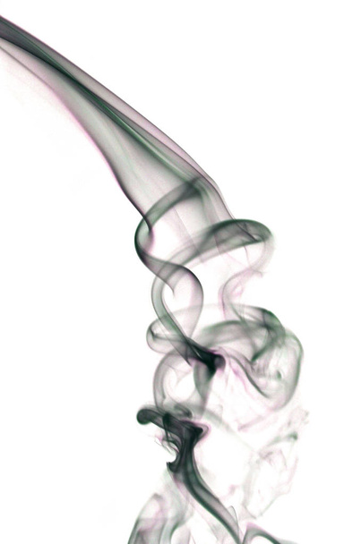 Swirling smoke from the incense on a homogeneous background - Foto, Imagen