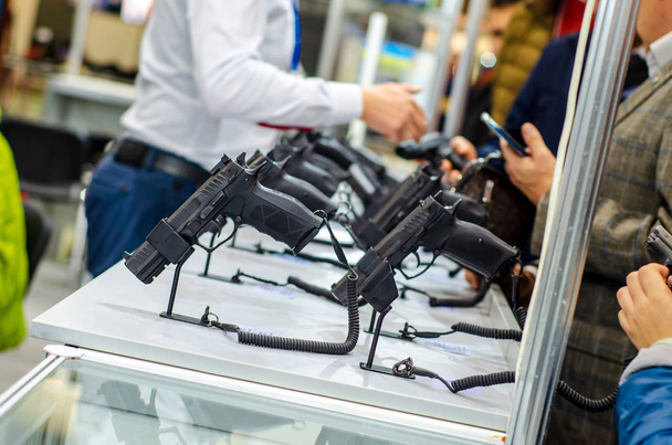 Gun Display Stands. Pistols for sale in the store. - Foto, Imagen