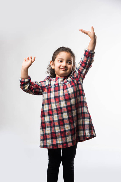 Indian small girl standing in style isolated over white background - Foto, Imagen