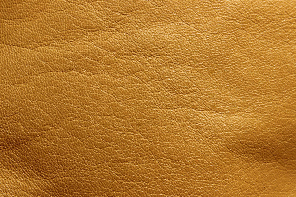 Blurred leather background, ocher color. Abstract texture background out of focus. Abstract light-brown background. - Photo, Image