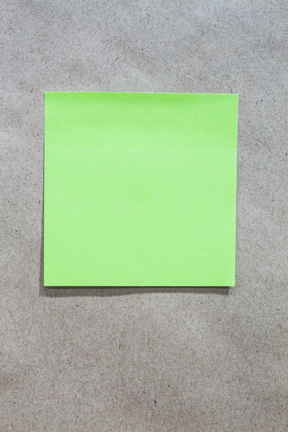 Brown gradient paper background with green note paper - Photo, Image