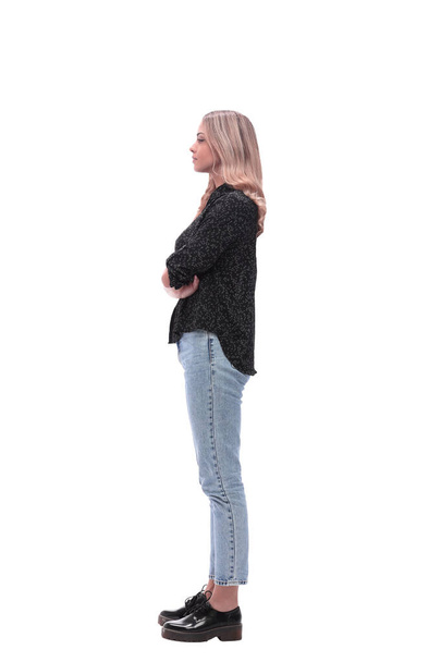vue latérale. jeune femme moderne en jeans et chemisier noir - Photo, image