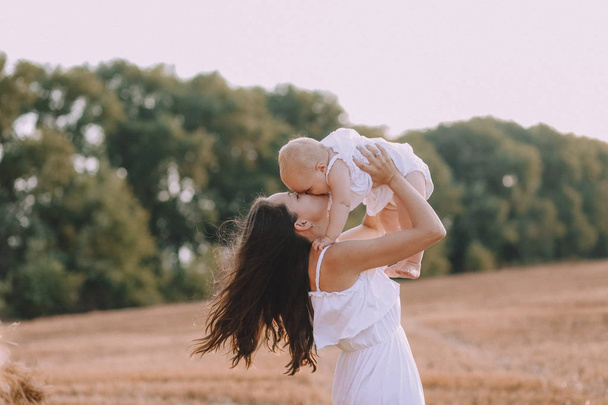 mother small daughter white dresses field straw - 写真・画像