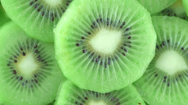 macro rotation video shooting of slice kiwi fruit .Close up flesh of kiwi. - Footage, Video