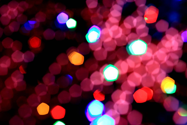 Abstract blurred colorful background with flickering light bulbs. Holiday concept. New Year's and Christmas - Foto, Imagem
