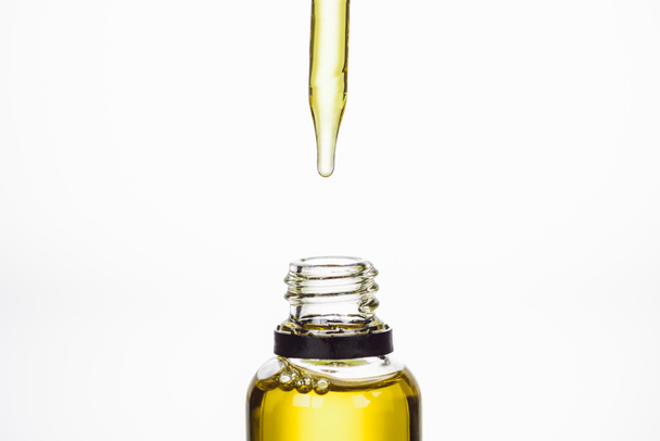 bottle and dropper with natural serum isolated on white - Φωτογραφία, εικόνα