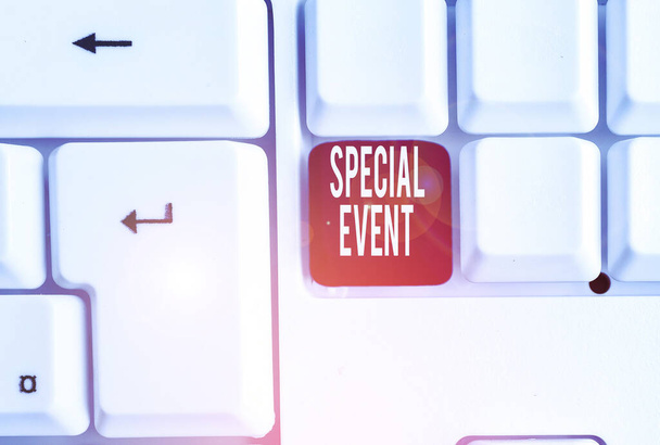 Writing note showing Special Event. Business photo showcasing Function to generate money for non profit a Crowded Occassion White pc keyboard with note paper above the white background. - Photo, Image