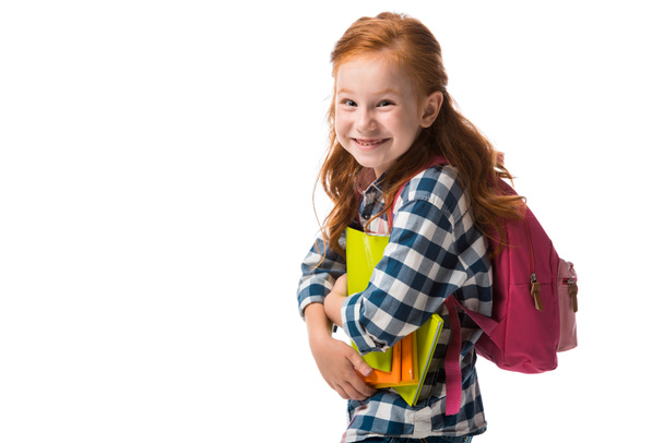 smiling redhead kid holding books isolated on white  - Fotografie, Obrázek