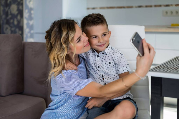 Mother with son taking selfie by smartphone - Zdjęcie, obraz