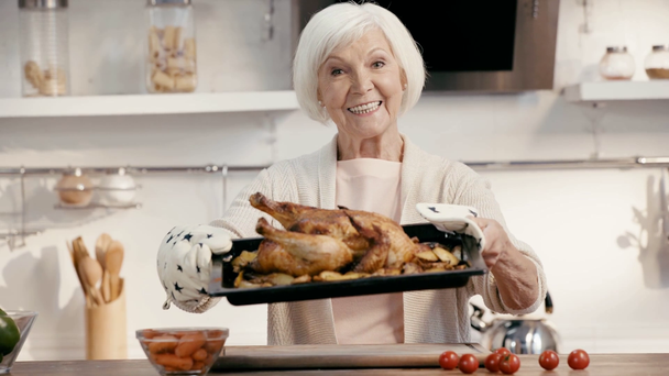 smiling woman holding tasty turkey  - Video