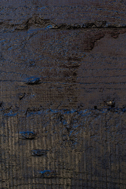 Black resin wall texture with scratches and cracks. - Foto, afbeelding