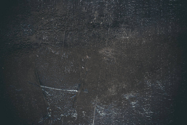 Black resin wall texture with scratches and cracks. - Zdjęcie, obraz