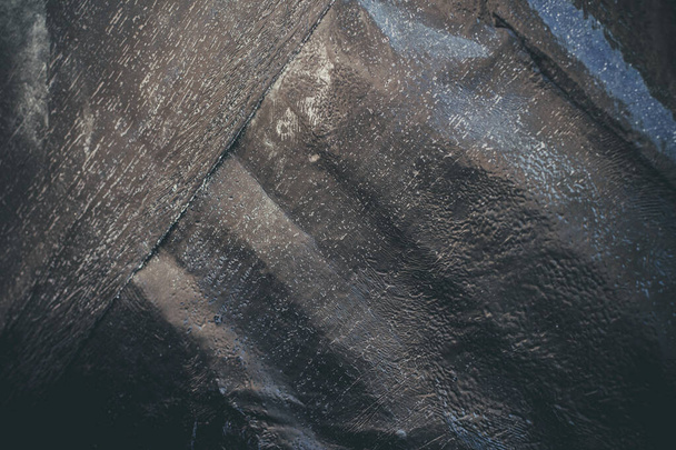 Black resin wall texture with scratches and cracks. - Photo, Image