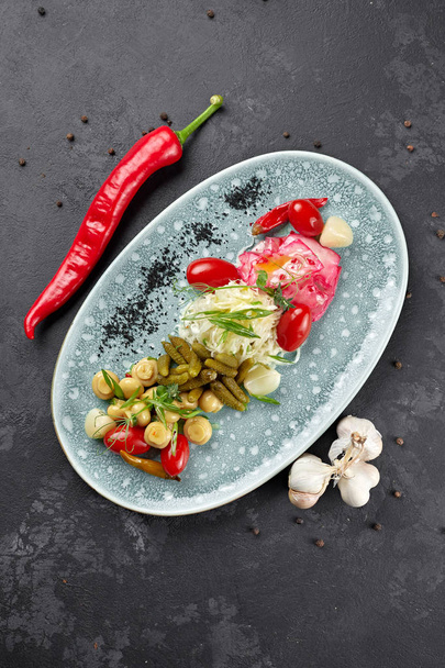 Marinated vegetables with mushrooms on a dark background - Foto, immagini