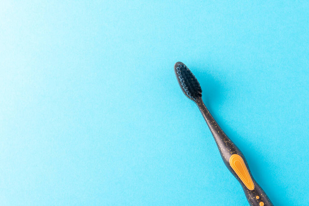 Toothbrush on a blue background with space for text - Foto, Imagen
