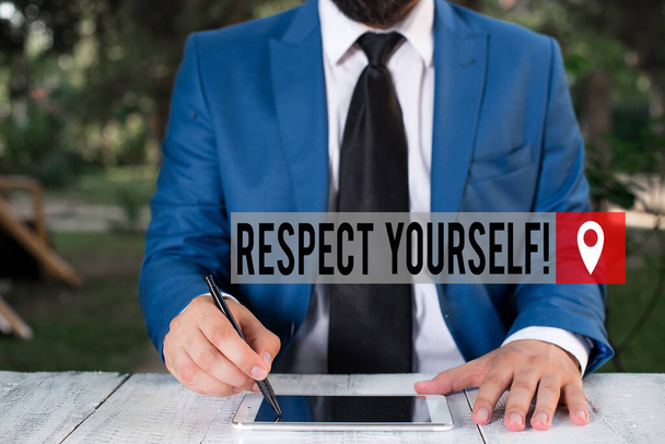 Word writing text Respect Yourself. Business concept for believing that you good and worthy being treated well Businessman holds pen and points into copy space. - Photo, Image