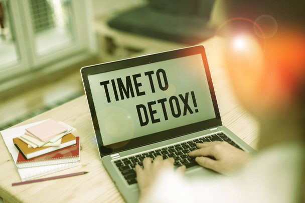 Text sign showing Time To Detox. Conceptual photo when you purify your body of toxins or stop consuming drug woman laptop computer office supplies technological devices inside home. - Photo, Image