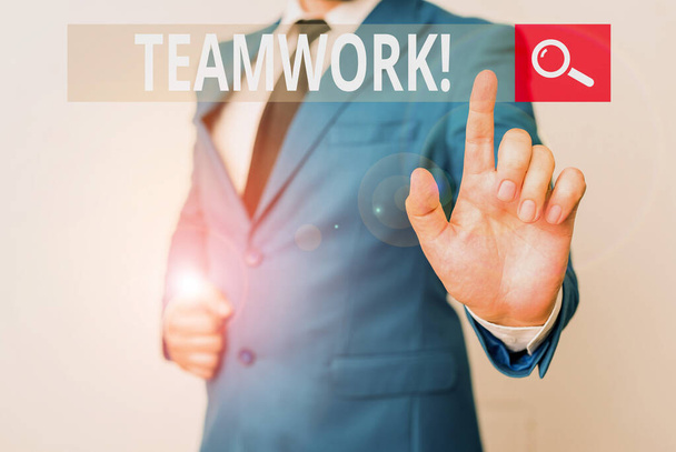 Conceptual hand writing showing Teamwork. Business photo text combined action of group especially when effective and efficient Businessman with pointing finger in front of him. - Photo, Image