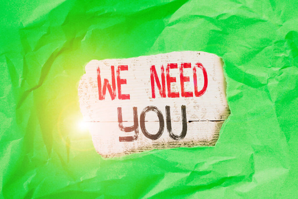 Conceptual hand writing showing We Need You. Business photo text to fulfill the needs of the assignment duty or obligation Green crumpled colored paper sheet torn colorful background. - Photo, Image