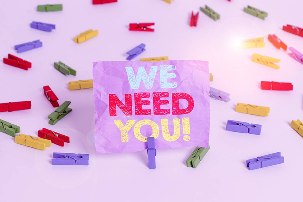 Writing note showing We Need You. Business photo showcasing to fulfill the needs of the assignment duty or obligation Colored clothespin papers empty reminder white floor background office. - Photo, Image