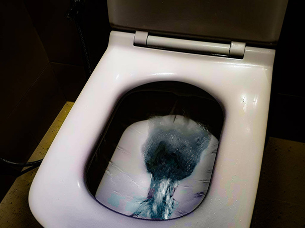 Toilet, Flushing Water, close up, flush toilet , White toilet in the bathroom, Top view of toilet bowl - Photo, Image