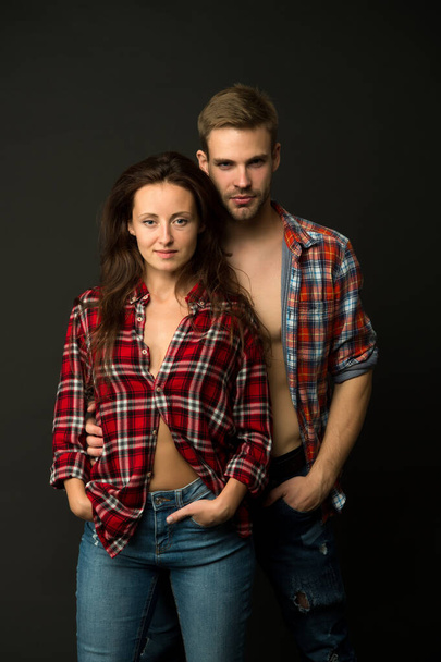 Rustic hipster style. Handsome man and woman looking similar in family style clothes. Casual and comfortable. Family posing photo session. Family look. Similar outfits. Couple wear checkered shirts - Fotografie, Obrázek