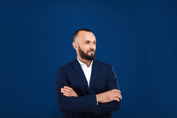Portrait of handsome man on blue background - Photo, Image
