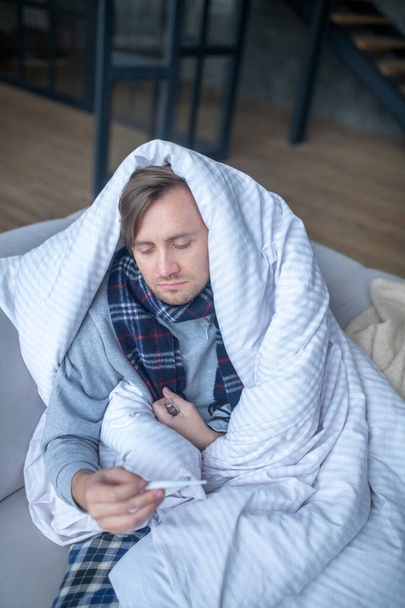 Top view of man feeling dizzy and exhausted while having flu - Zdjęcie, obraz