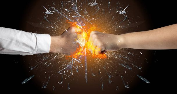 Fighting hands breaking glass - Photo, Image