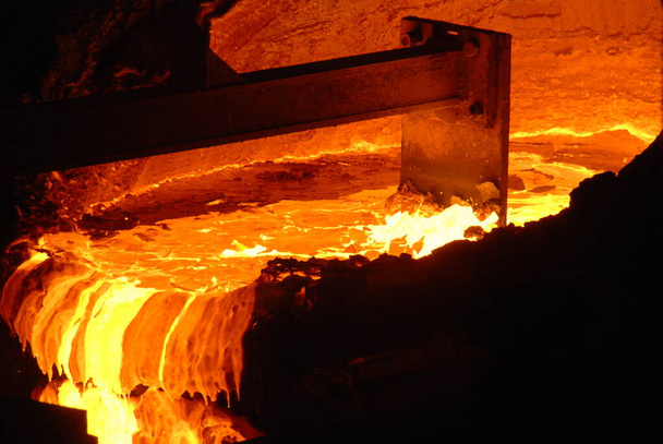 Very rare close view of working open hearth furnace at the metallurgical plant. Molten hot steel - Photo, Image