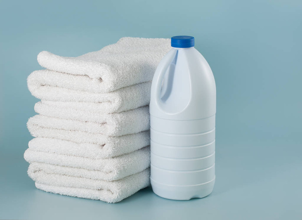 laundry launderer bleach bottles and terry towel - Фото, изображение