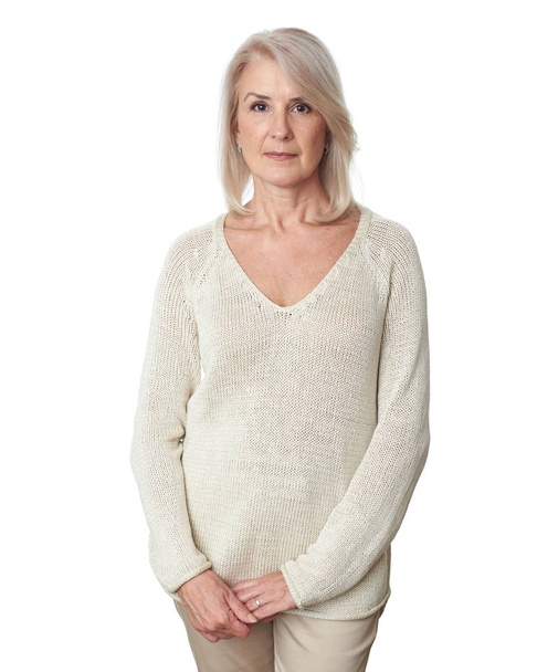 casual mature woman while standing against white background - Photo, Image