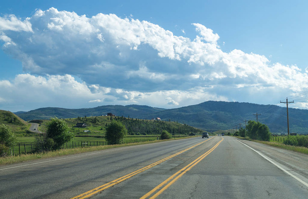 Freeway in the countryside and mountains. Rocky Mountains National Park, USA - Photo, image