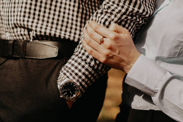 Hands of couple. Couple of lovers holding hands. Hand with wrist watch. - Photo, Image