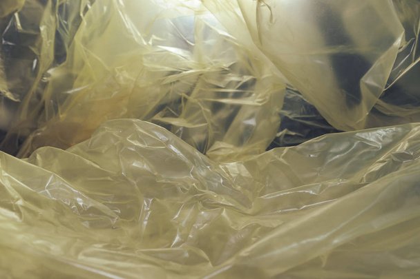 Krásné žluté plastové tašky abstraktní pozadí. No Plastic Bag Concept, save world, protect earth. - Fotografie, Obrázek