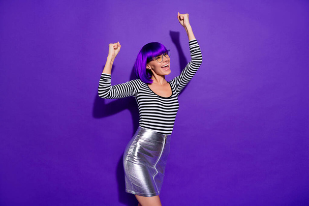 Portrait of lovely person raising fists screaming yeah wearing eyeglasses eyewear isolated over purple violet background - Foto, Imagen