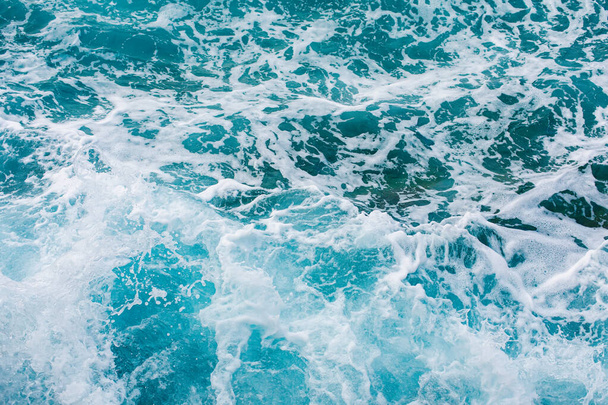 Turquoise sea surface background with splashing waves - Φωτογραφία, εικόνα
