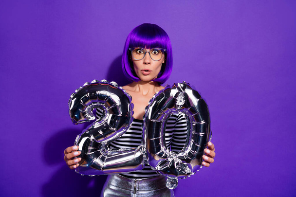 Staring lady hold hands ballons not believe its already her birthday wear specs striped pullover isolated purple background - Photo, image