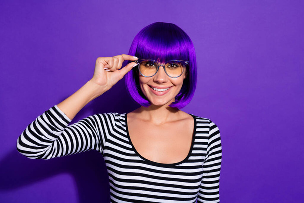Photo of beautiful lady touch hand new specs glad good sight wear wig striped pullover isolated purple background - Фото, зображення