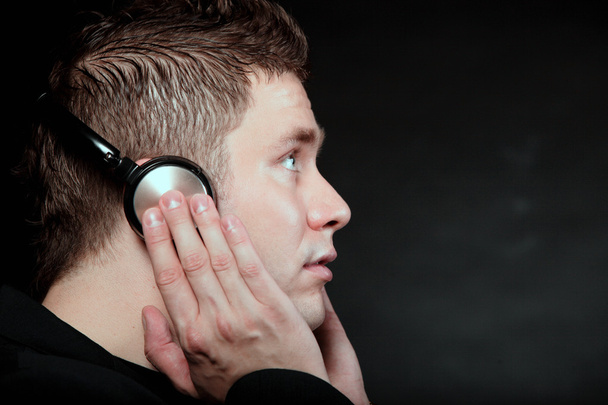 young man with headphones listening to music - Foto, Imagem