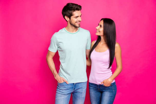 Photo of amazing couple guy and lady in love standing hugging enjoy best company wear casual clothes isolated bright pink color background - Фото, зображення