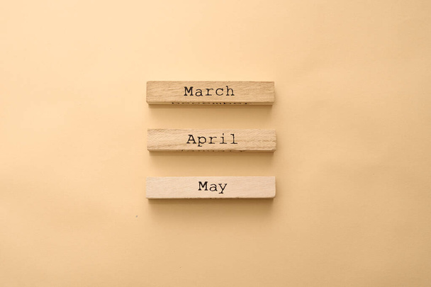 Wooden calendar spring months on wooden cubes. Top view Flat Lay Minimal - Φωτογραφία, εικόνα