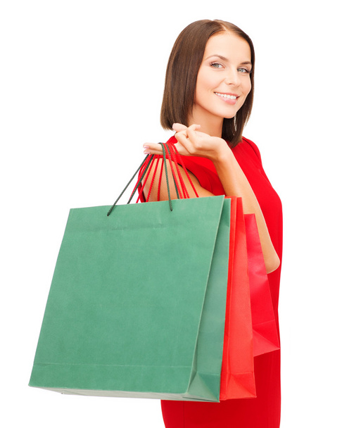 Woman in red dress with shopping bags - Φωτογραφία, εικόνα
