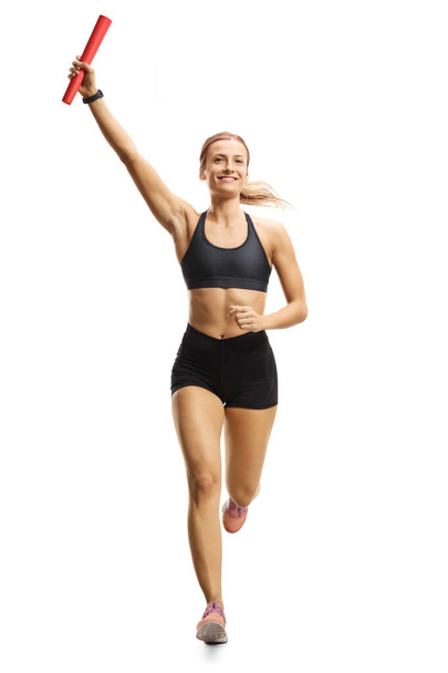 Female runner with a baton in her hand - Foto, imagen