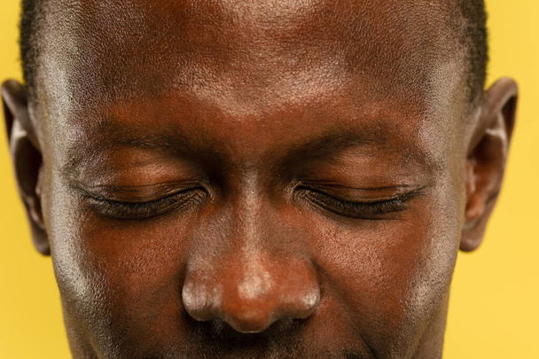 African-american young mans close up portrait on yellow background - Foto, Bild