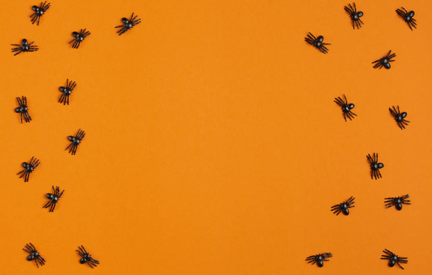 background for halloween, spiders on an orange table - Zdjęcie, obraz
