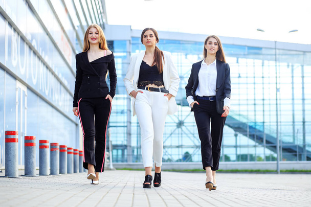 Three successful women left the office. Concept for business, bo - Photo, Image