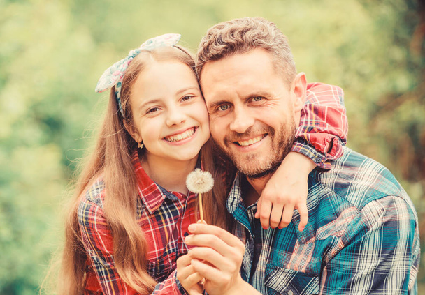 daughter and father with dandelion flower. family summer farm. little girl and happy man dad. earth day. spring village country. ecology. Happy family day. Little plant. Enriching soil - Фото, изображение